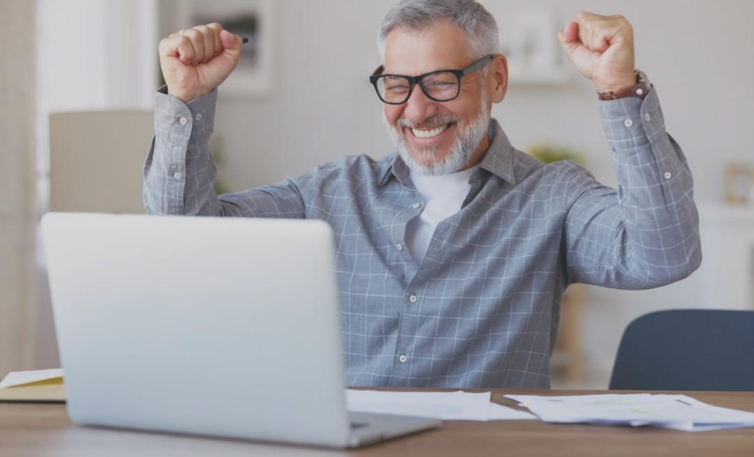 Financial charts and analysis tools spread across desk